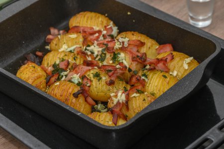 baked potatoes with bacon in the kitchen 3