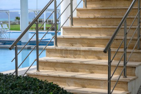 Photo for Staircase near the pool in a residential complex 1 - Royalty Free Image