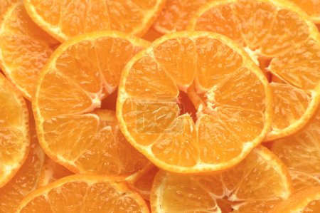 juicy and appetizing tangerines cut into circles as a food background 5