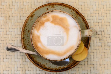 Cup of cappuccino on a table in a cafe. Beautiful foam, white ceramic cup, copy space.2