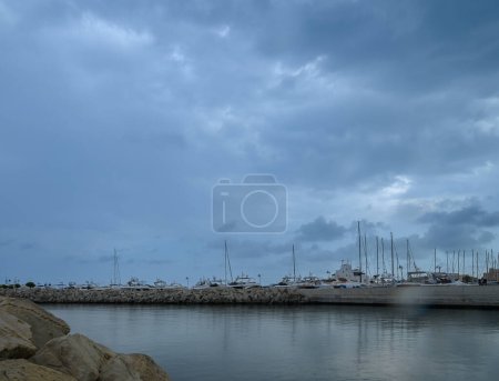 LIMASSOL, CYPRUS - APRIL 15, 2024: Old port of Limassol with beautiful fishing boats at sunset 10