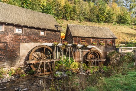 Photo for Furtwangen, Baden-Wuerttemberg, Germany - October 17, 2023. Hexenlochmuehle, Hexenloch Mill, traditional water mill with two water wheels in the Black Forest - Royalty Free Image