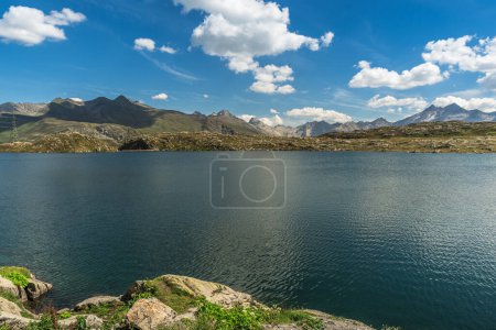 Photo for Mountain landscape with Totensee lake at the Grimsel Pass, a mountain pass in Switzerland that connects the Bernese Oberland with the Canton of Valais - Royalty Free Image