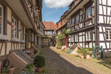 Alley with cobblestones and half-timbered houses in the historic old town of Gengenbach, Kinzigtal, Black Forest, Baden-Wuerttemberg, Germany