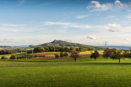 Hegau landscape in autumn, fields and meadows with view to Hohenhewen and Hohentwiel (in the background), Watterdingen, Baden-Wuerttemberg, Germany