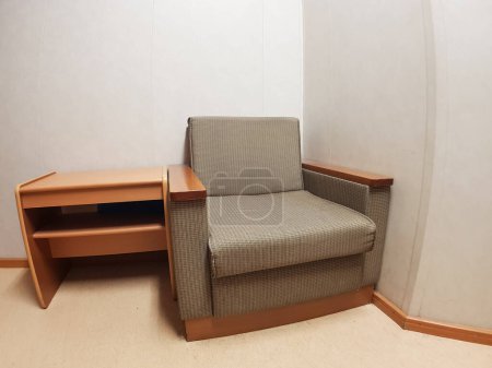 Photo for Couch and a small table in the corner - Royalty Free Image