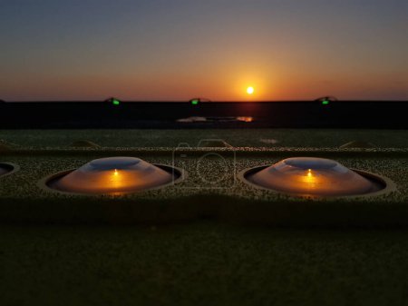 Photo for Close up photo shot of warning lights on helicopter platform during sunset - Royalty Free Image
