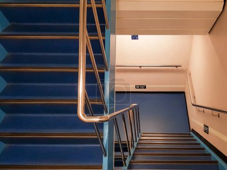 Blue colored stairway and handrails