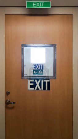 Exit door and emergency exit signs cascaded