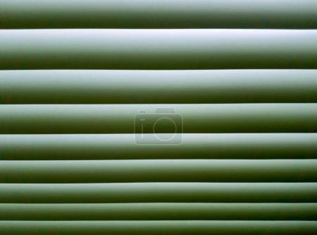 Photo for Green parallel lines on blinds with gradient shade - Royalty Free Image
