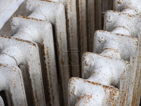Photo for White old cast iron batteries close up. Old cast iron central heating battery. Scrap metal and recyclables. Delivery of scrap metal, replacement of the heating system in the apartment. - Royalty Free Image