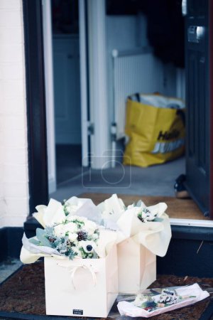 Photo for Beautiful bouquets of flowers at the entrance - Royalty Free Image