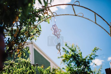 Photo for Beautiful hanging heart decoration against blue sky - Royalty Free Image