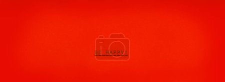Foto de Be happy! on horizontal red paper. Real typrewrite. - Imagen libre de derechos