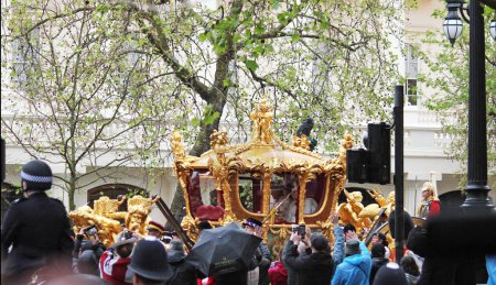 Photo for London, England, UK. 6th May, 2023. King CHARLES III and Queen Consort Camilla in Golden state carriage to Buckingham Palace following the coronation. King Queen both wearing crown - Royalty Free Image