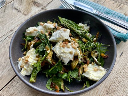 Photo for Mozzarella with roasted heritage carrot and asparagus with rocket salad - Royalty Free Image