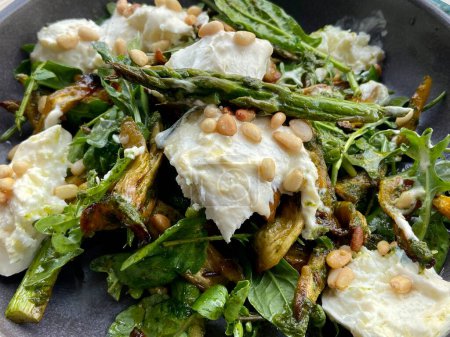 Photo for Mozzarella with roasted heritage carrot and asparagus with rocket salad - Royalty Free Image