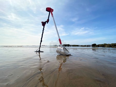 Photo for Sand scoop metal detecting metal detector beach stock photo - Royalty Free Image