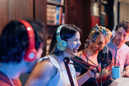young people having fun in on line streaming podcast - selective focus on headphones