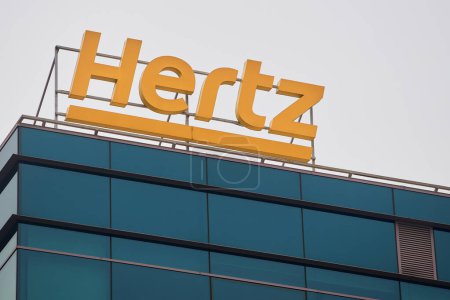 Photo for Bucharest, Romania - January 13, 2023: The logo of the American car rental company Hertz can be seen on a building. This image is for editorial use only. - Royalty Free Image
