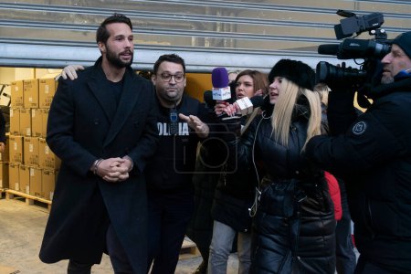 Photo for Bucharest, Romania - January 25, 2023: Tristan Tate and his brother leave the Directorate for Investigating Organized Crime and Terrorism DIICOT where their phones and laptops were searched - Royalty Free Image