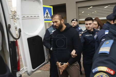 Photo for Bucharest, Romania - February 06, 2023: Andrew Tate and his brother leave the Directorate for Investigating Organized Crime and Terrorism where they were investigated for human trafficking and rape. - Royalty Free Image