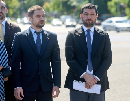 Photo for Bucharest, Romania. 7th August, 2023: Adrian George Axinia (L), vice-president AUR, and Marius Lulea (R), first vice-president of Alliance for Romanians Unification (AUR), attend an extraordinary press conference on the increase in taxes and fees ann - Royalty Free Image