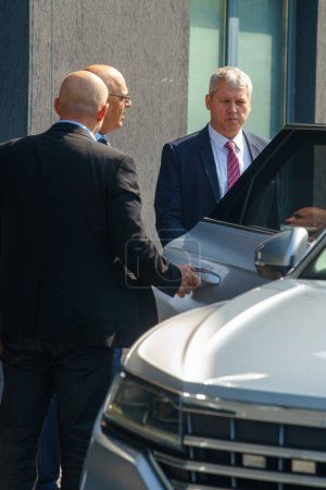 Photo for Bucharest, Romania. 5th July, 2023: Catalin Predoiu (R) and Raed Arafat (C) leave the presentation of 15 of the 25 advanced medical stations and four radio support vehicles assigned to IGSU - Royalty Free Image