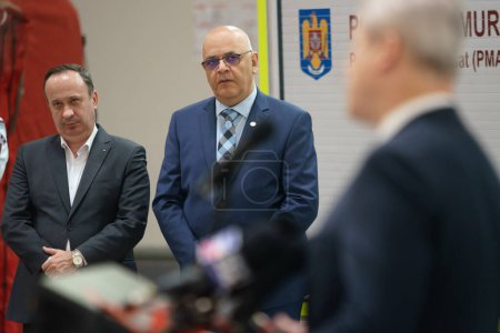 Photo for Bucharest, Romania. 5th July, 2023: Adrian Caciu (L) and Raed Arafat (C) attend the presentation of 15 of the 25 advanced medical stations and four radio support vehicles assigned to IGSU - Royalty Free Image