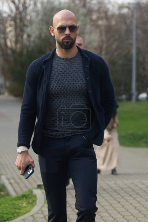Photo for Bucharest, Romania. 7th Mar, 2024: Andrew Tate and his brother Tristan Tate (not in picture) leave the Bucharest Court. - Royalty Free Image