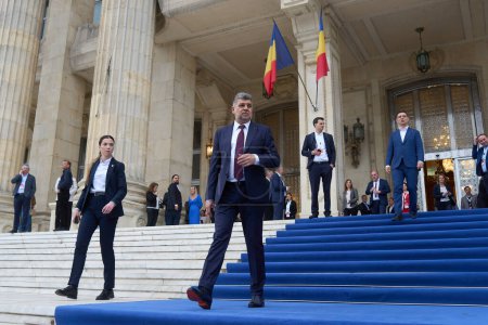 Photo for Bucharest, Romania. 6th Apr, 2024: Marcel Ciolacu (C), Romanian Premier and PSD president, leaves after the PES conference, held at the Palace of the Romanian Parliament. - Royalty Free Image