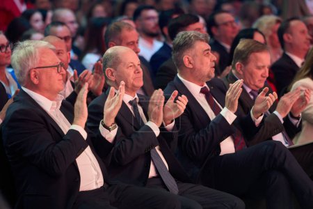 Photo for Bucharest, Romania. 6th Apr, 2024: (L-R) Nicolas Schmit, PES lead candidate for the EU elections, Olaf Scholz, Chancellor of Germany, and Marcel Ciolacu, Romanian Premier and PSD president, applaud - Royalty Free Image
