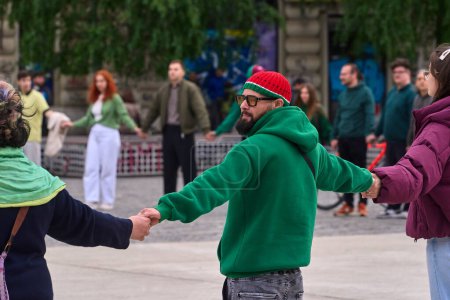 Photo for Bucharest, Romania. 20th Apr, 2024: Attendants joined in a circle protest during a one-minute flash mob at 16:20, in University Square in Bucharest, against the laws voted by the Romanian Parliament and promulgated by the President, by which drug use - Royalty Free Image