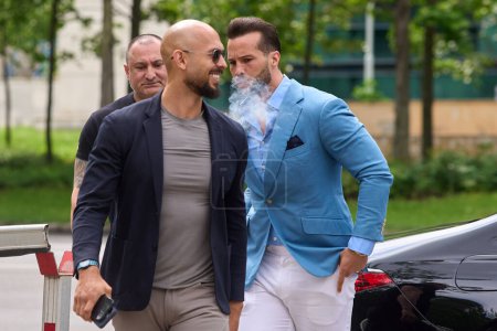 Photo for Bucharest, Romania. 8th May, 2024: Andrew Tate (L) and his brother Tristan Tate (R) arrive at the Bucharest Court. - Royalty Free Image