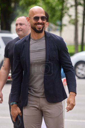 Photo for Bucharest, Romania. 8th May, 2024: Andrew Tate and his brother Tristan Tate (not in picture) arrive at the Bucharest Court. - Royalty Free Image