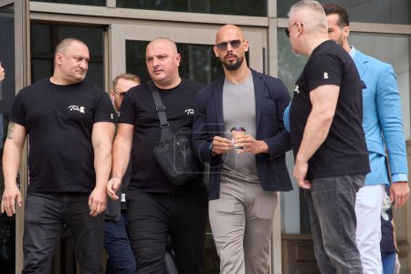 Photo for Bucharest, Romania. 8th May, 2024: Andrew Tate (C-R) and his brother Tristan Tate leave the Bucharest Court. - Royalty Free Image