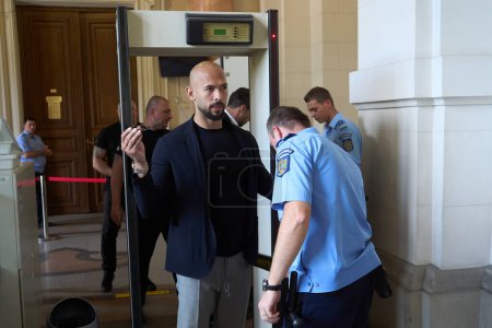 Photo for Bucharest, Romania. 30th May, 2024: Andrew Tate (C) and his brother Tristan Tate arrive at the Bucharest Court of Appeal. - Royalty Free Image
