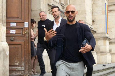 Photo for Bucharest, Romania. 30th May, 2024: Andrew Tate (R) and his brother Tristan Tate (C) leave the Bucharest Court of Appeal. - Royalty Free Image
