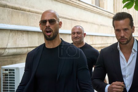 Photo for Bucharest, Romania. 30th May, 2024: Andrew Tate (L) and his brother Tristan Tate (R) leave the Bucharest Court of Appeal. - Royalty Free Image