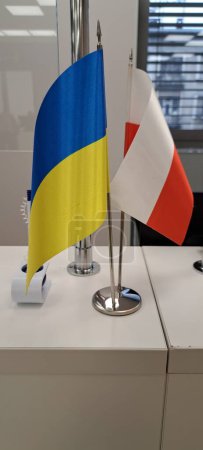 Foto de Dos banderas de Ucrania y Polonia, amarillo-azul y rojo-blanco - Imagen libre de derechos