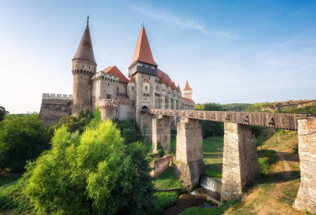 Photo for Summer view with Corvin castle with bridge over a small river in a sunny day in Romania - Royalty Free Image
