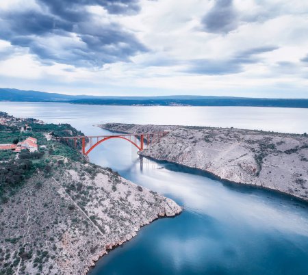 Photo for Aerial panoramic view with Maslenica bridge - a deck arch bridge near town of Zadar in Croatia with beautiful clouds and vibrant sea - Royalty Free Image