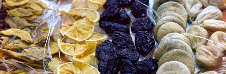Photo for Dried fruit background. Rows of dried dates, apricots, lemon, prunes and figs. High quality photo - Royalty Free Image