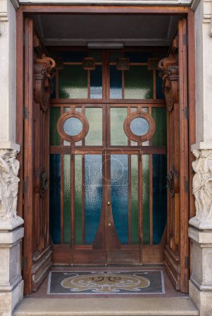 an entrance door in Littorio architectural style. High quality photo