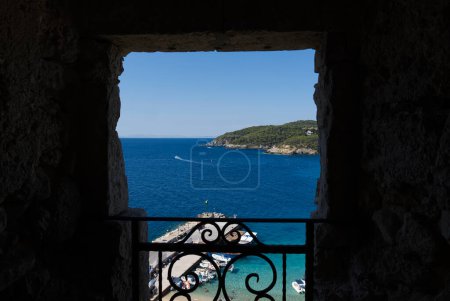 glimpse of the Tremiti islands from a window. Puglia, Italy. High quality photo