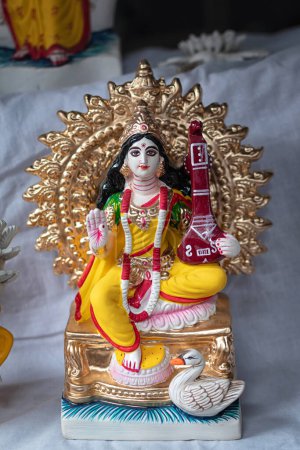 Idol of Goddess Devi Saraswati is in preparation for the upcoming Saraswati Puja at a pottery studio in Kolkata, West Bengal, India.