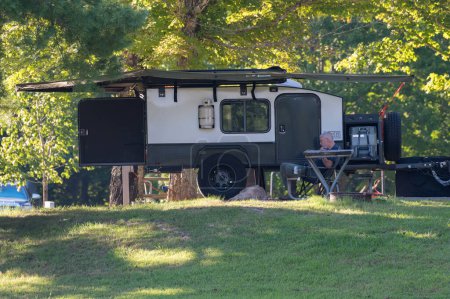 Photo for Burkesville, KY - August 11, 2023: Small teardrop travel trailer parked at Dale Hollow State Park Campground site. High quality photo - Royalty Free Image