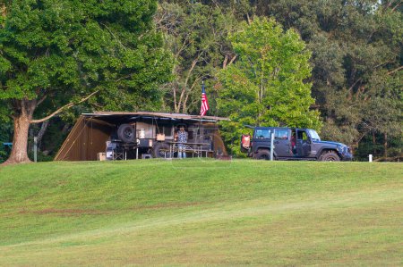 Photo for Burkesville, KY - August 11, 2023: Small teardrop travel trailer parked on a hill at Dale Hollow State Park Campground site. High quality photo - Royalty Free Image