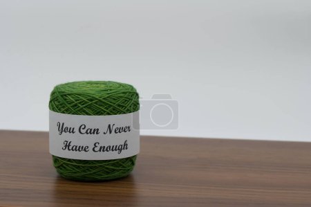 Green Yarn Skein with Humorous You Can Never Have Enough Label. High quality photo
