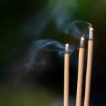 Selective focus, Incense sticks burning with smoke, Worship in Asian beliefs and faith